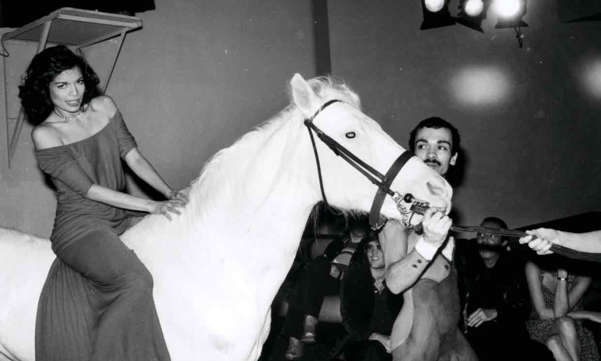 Bianca Jagger riding white horse at Studio 54
